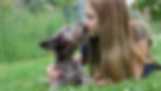 Dog gives a girl kisses