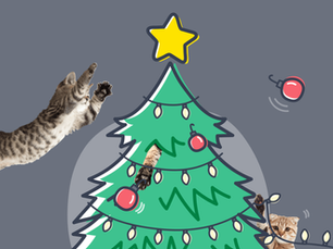 cat jumping onto a cartoon christmas tree